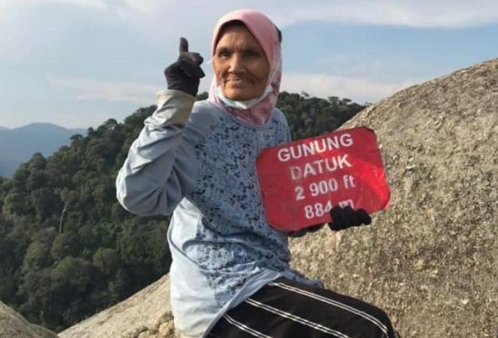 Ms Siti reaching the peak of Gunung Datuk.