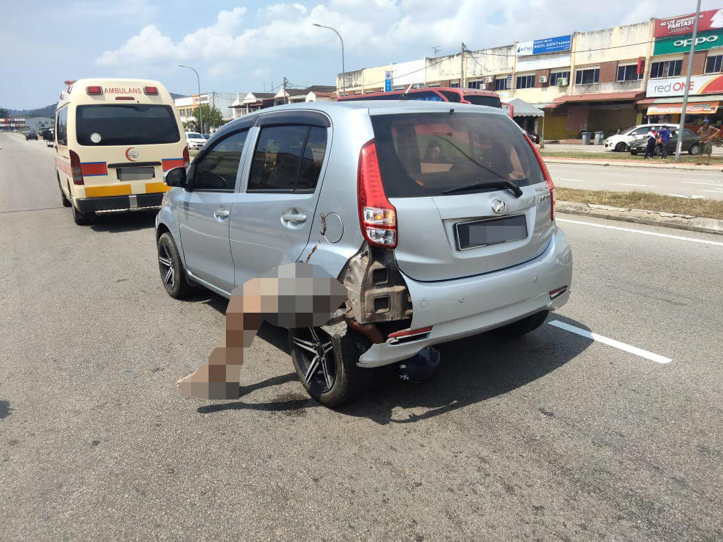 A motorcyclist died after being run-over and getting stuck in the wheel well of a Perodua Myvi. Image credit: FBT News