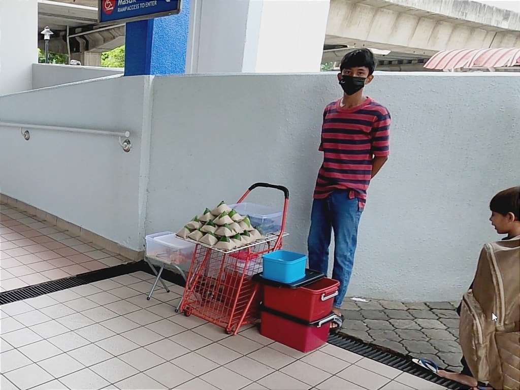 16-year-old Ilham has been selling nasi lemak and pulut panggang to help alleviate his family's financial burden since he was 10-years-old. Image credit: FS Channel