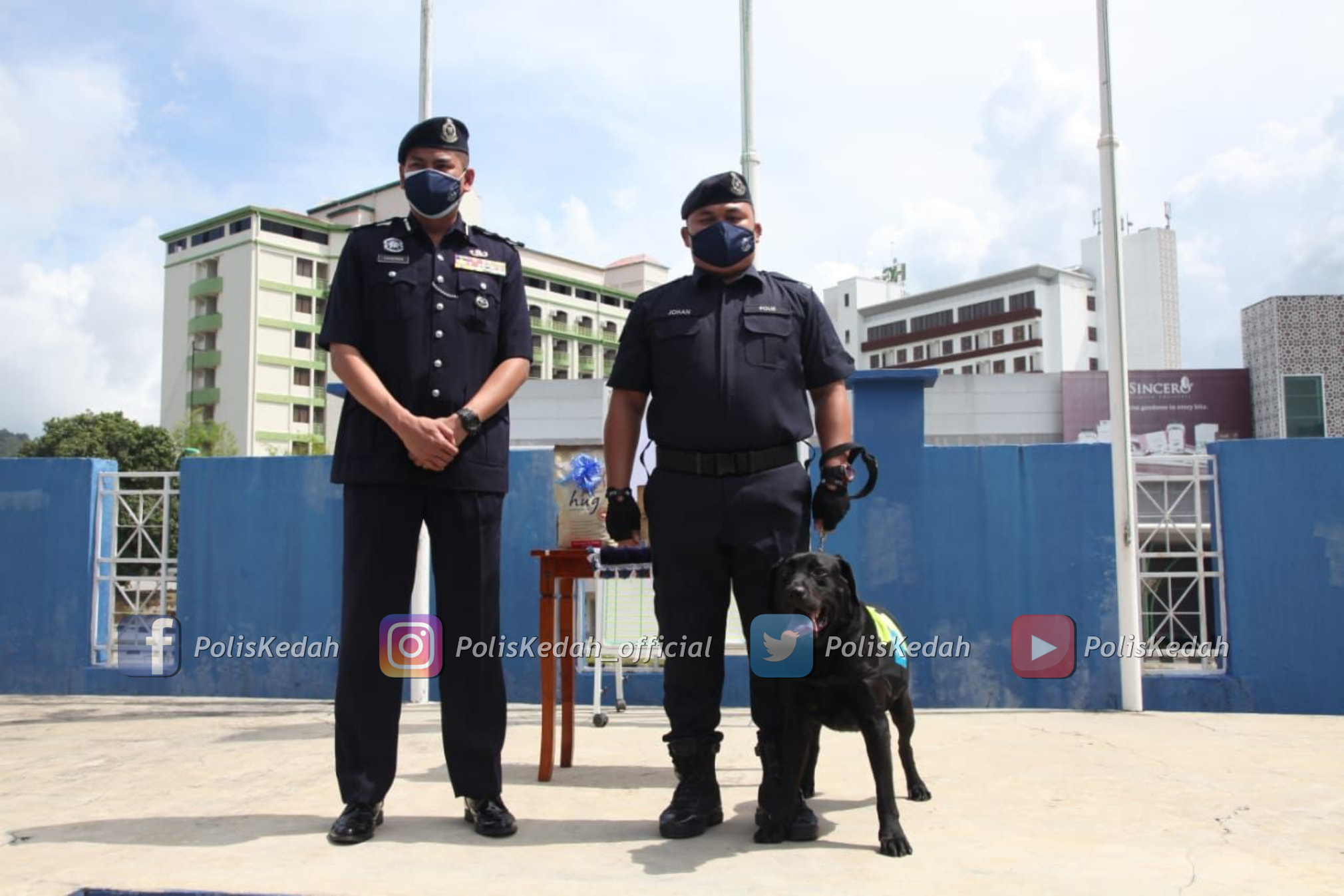 Black standing proudly at his appreciation ceremony.