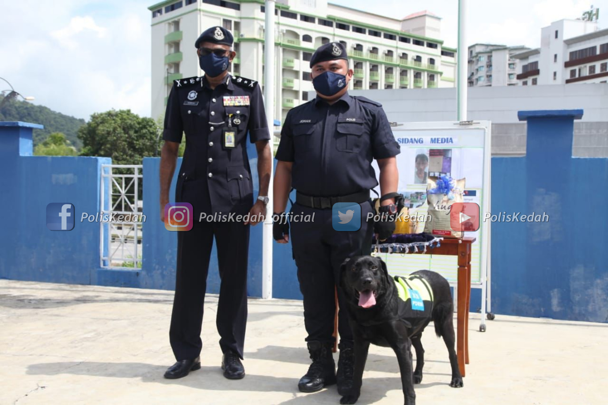 Black appearing elated next to police officers.