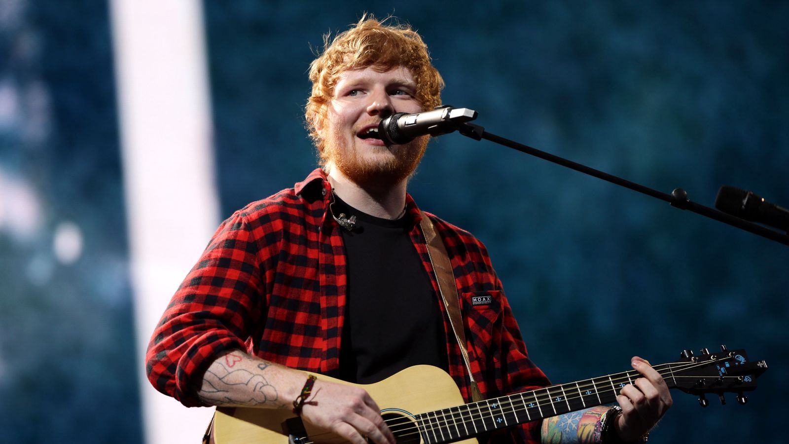 Ed Sheeran performing live.