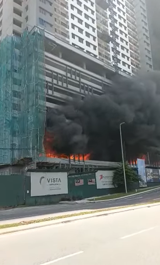Side-view of Taman Melati apartment on fire.