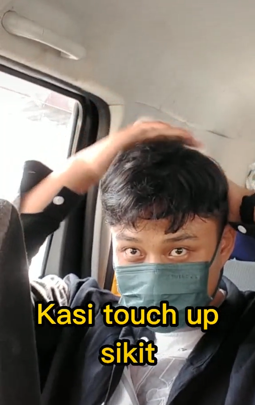 Young man touches-up his hair for his first date.