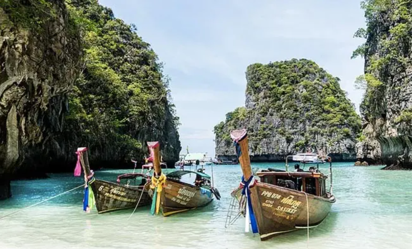 Traditional Thai boats at shore.