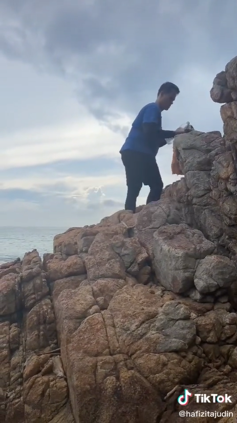 Hiker finds discarded litter around a scenic spot.