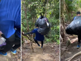 Hiker carrying 10kg of trash down from a hiking trail.