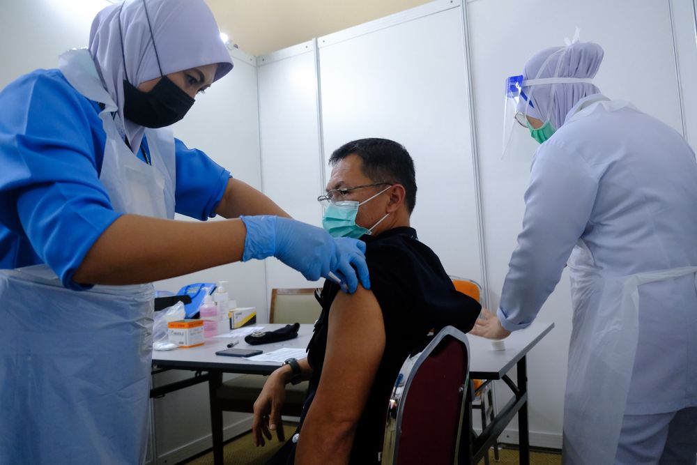 A Malaysian man receiving his vaccination.