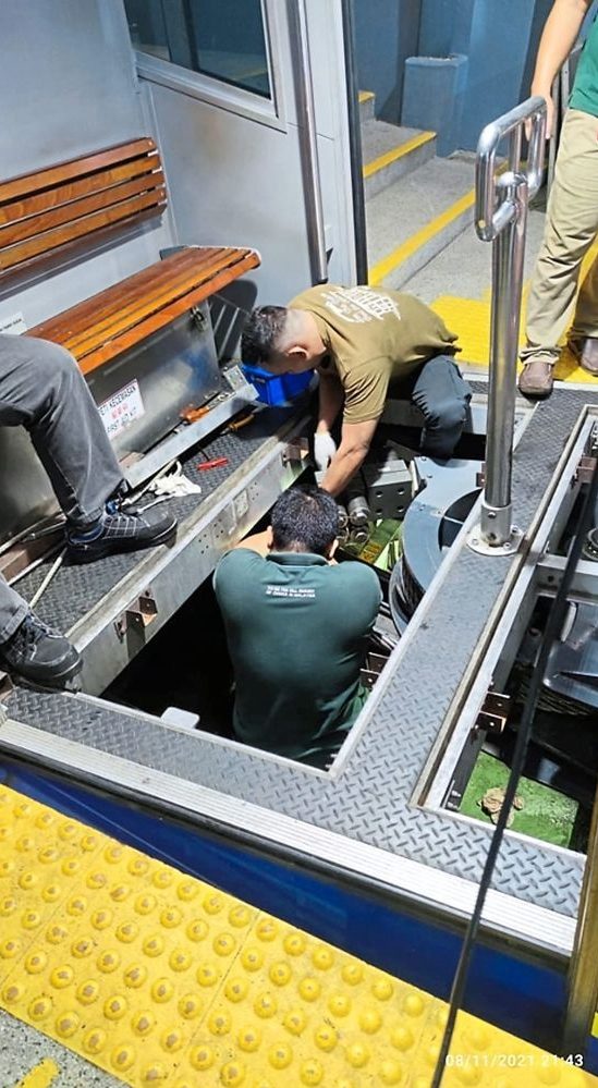 A technician repairing the Penang Hill train.