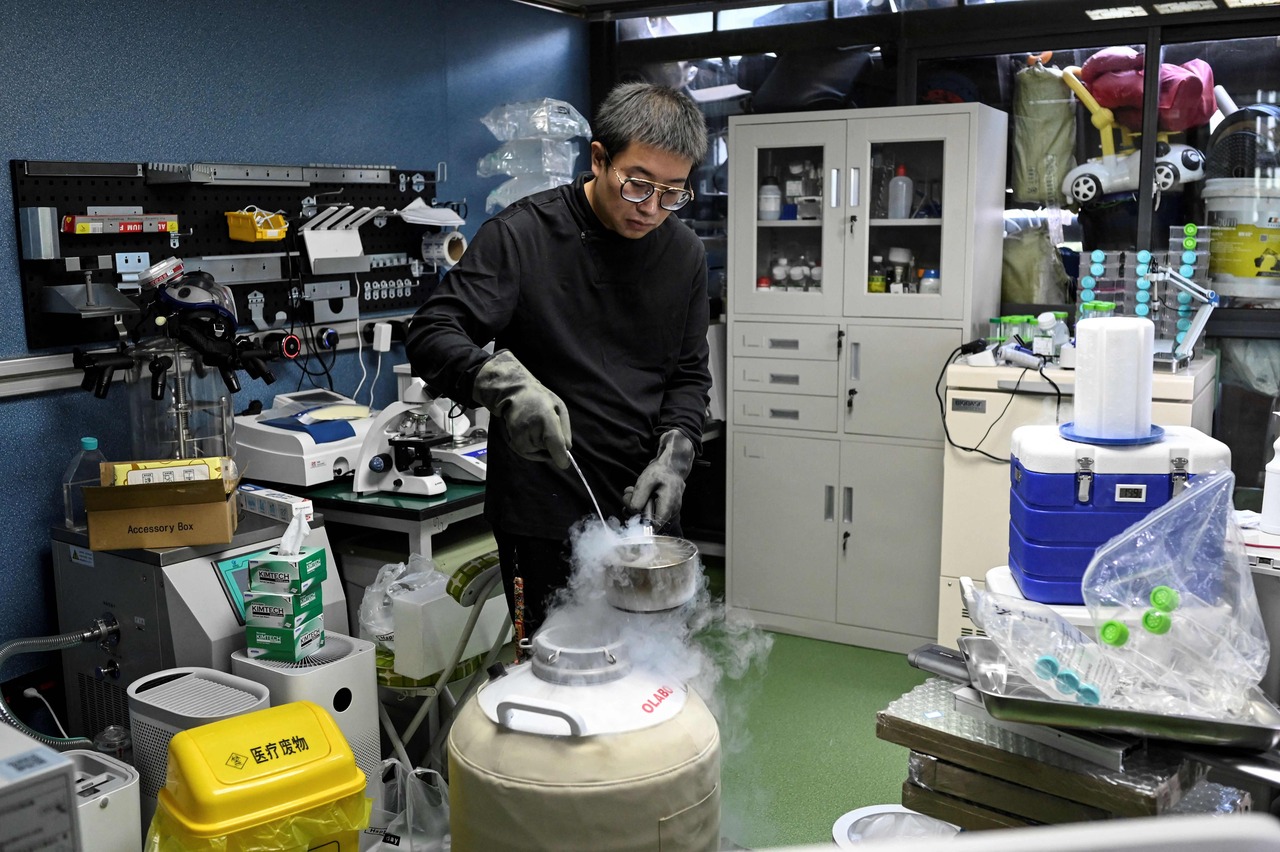 Mr Xu in his home lab making medicine for his son, who suffers from Menkes syndrome.