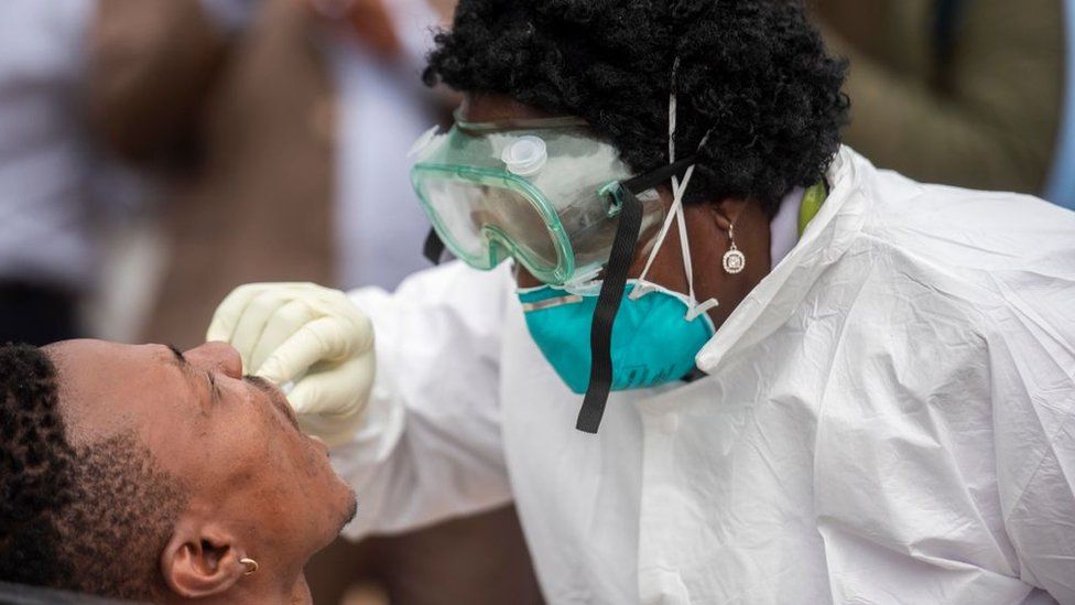 A man receiving a COVID swab test.