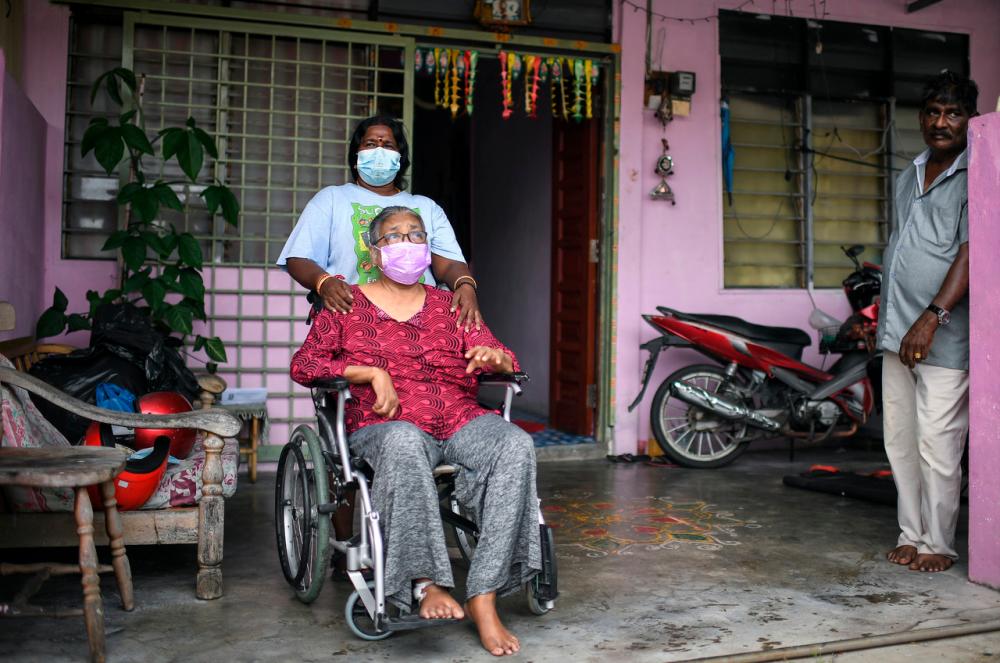 Ms Devika with 70-year-old Ms Supiah.