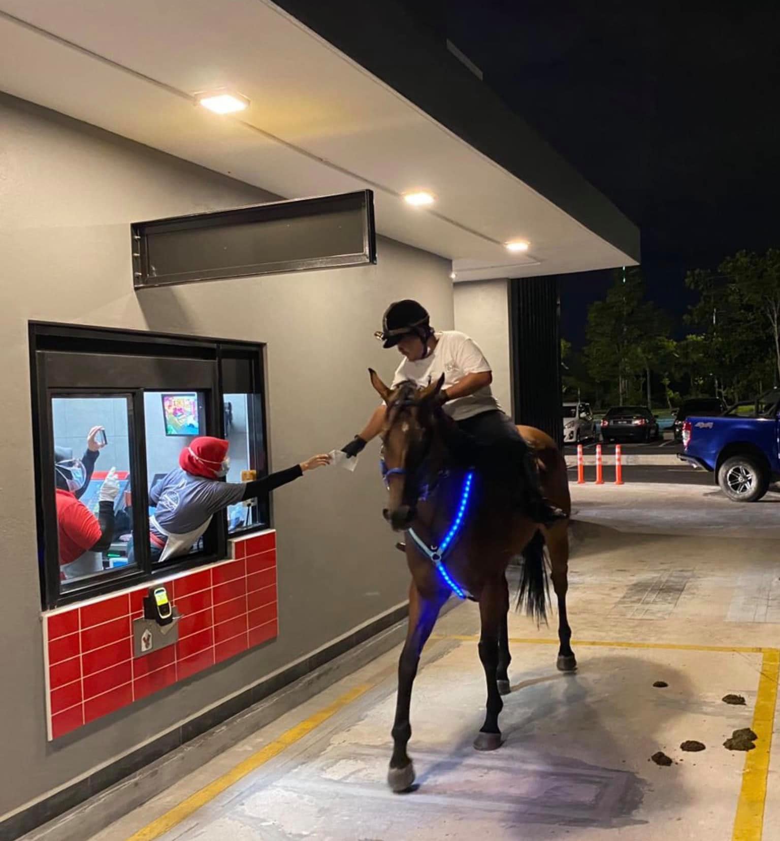 Collecting food from the drive-thru.