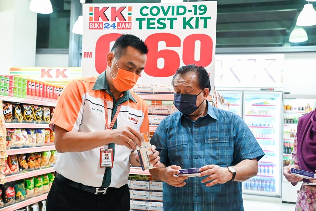 Alexander Nanta Linggi inspecting the test kits for sale.