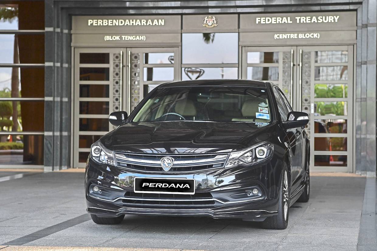 A Proton Perdana parked outside government offices.
