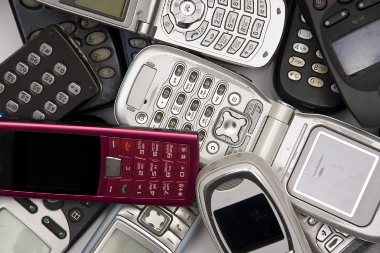 A pile of old mobile phones.