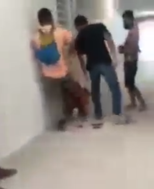 Local contractors assaulting the foreign worker.