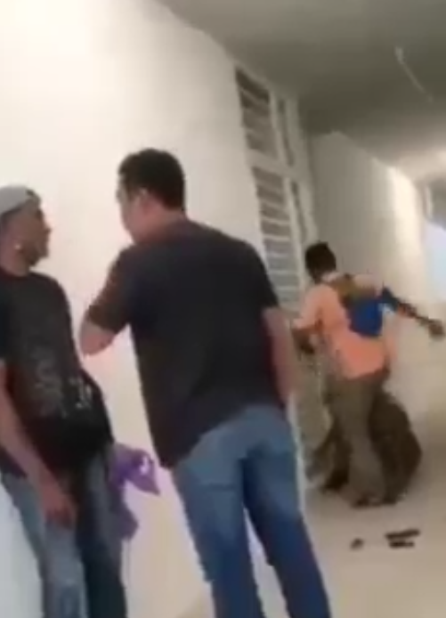 Local contractors assaulting the foreign worker.