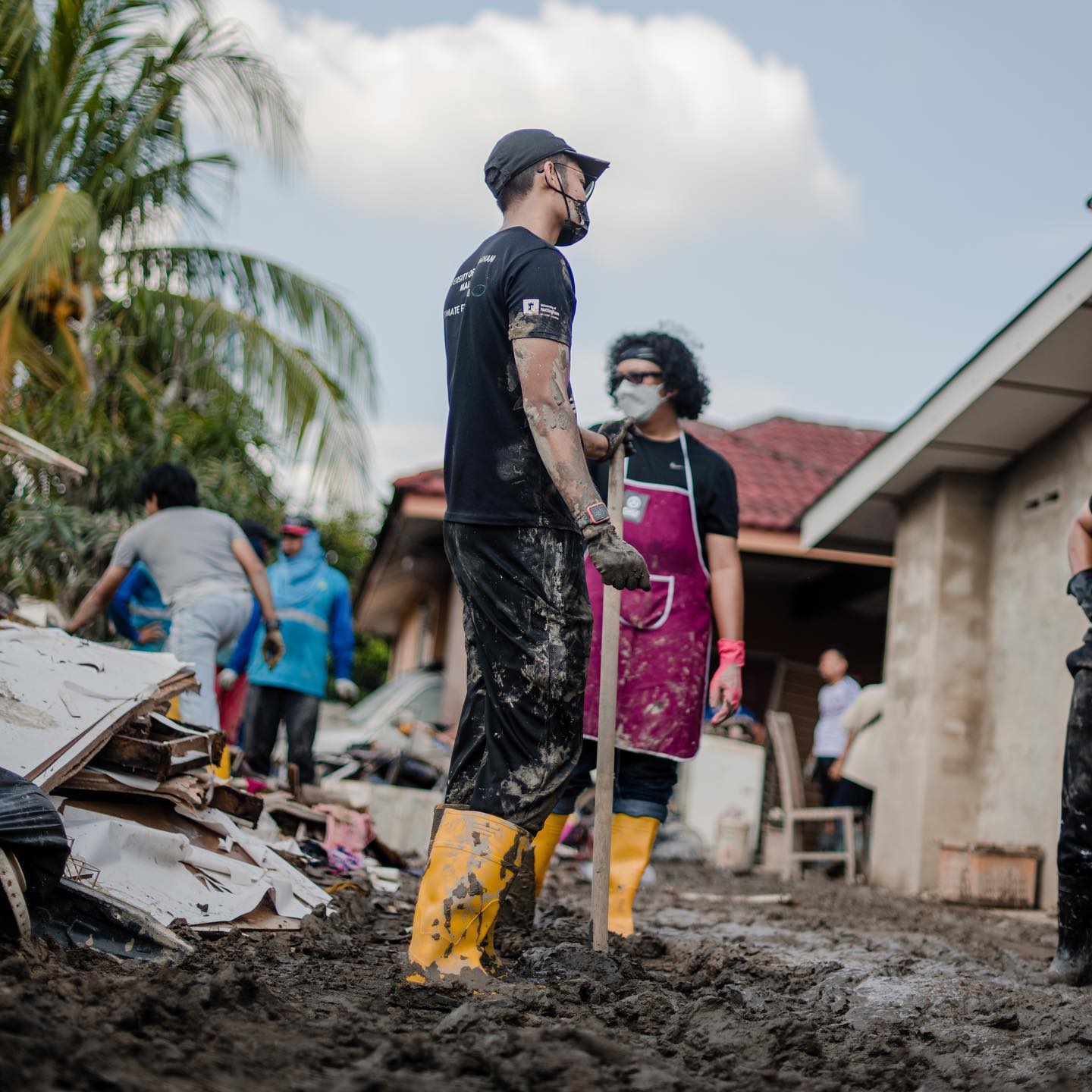 Volunteers helping to clean up the homes of flood victims.