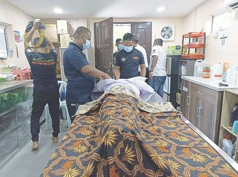 The body of the deceased being prepared for funerary rites.