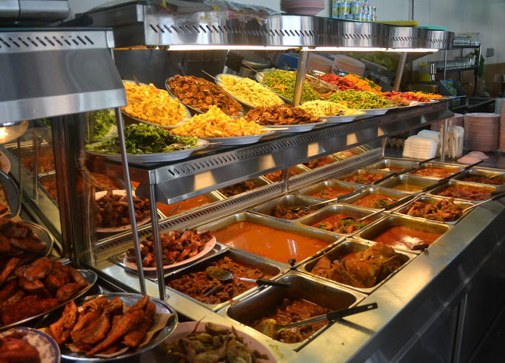 Food displayed at a mamak restaurant. 