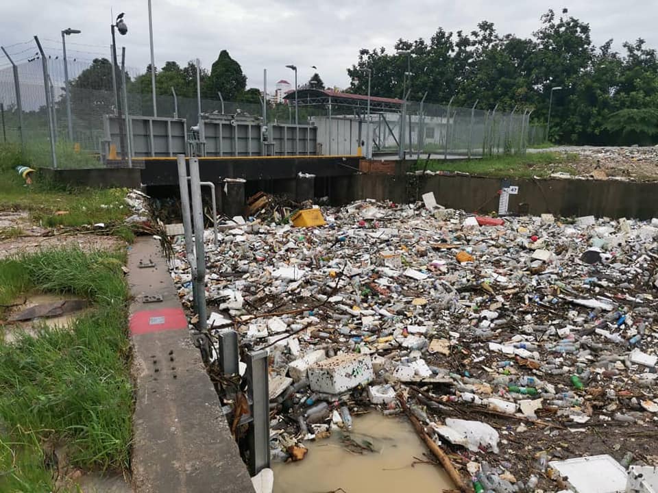 The state of drains and rivers in Kuala Lumpur, clogged with rubbish.