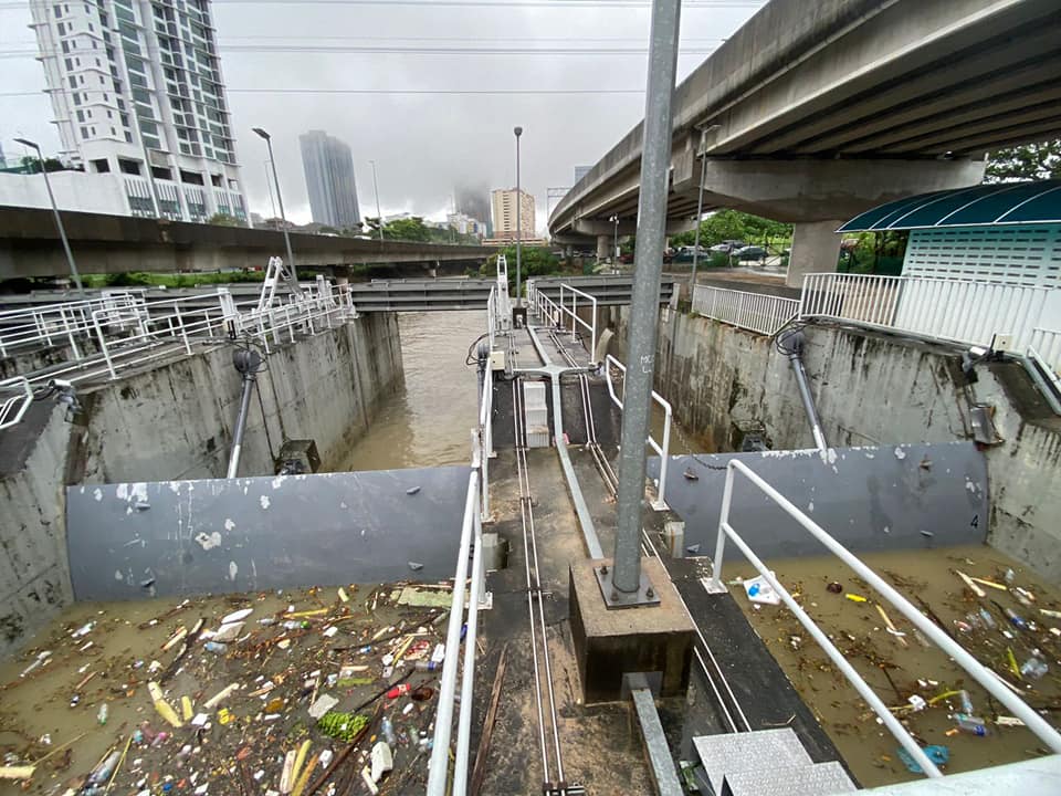 The state of drains and rivers in Kuala Lumpur, clogged with rubbish.