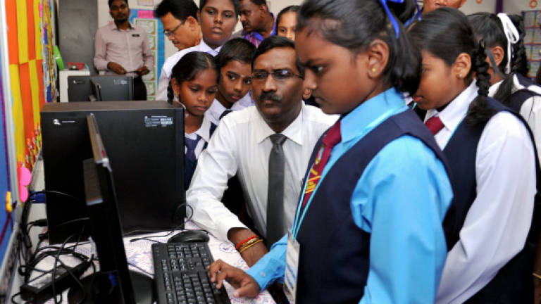 A Tamil vernacular school student using the computer.