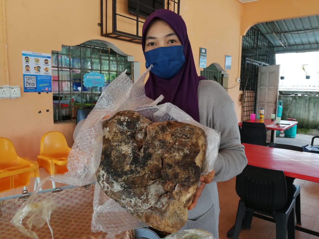 Aida posing with the whale vomit.