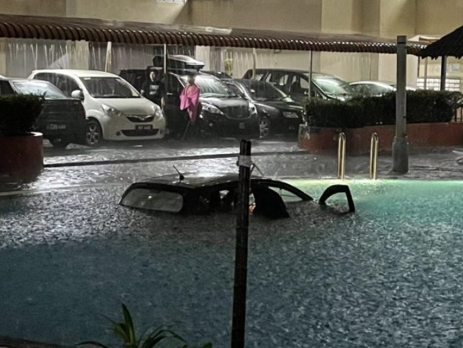 The car seen after it had accidentally plunged into a swimming pool.