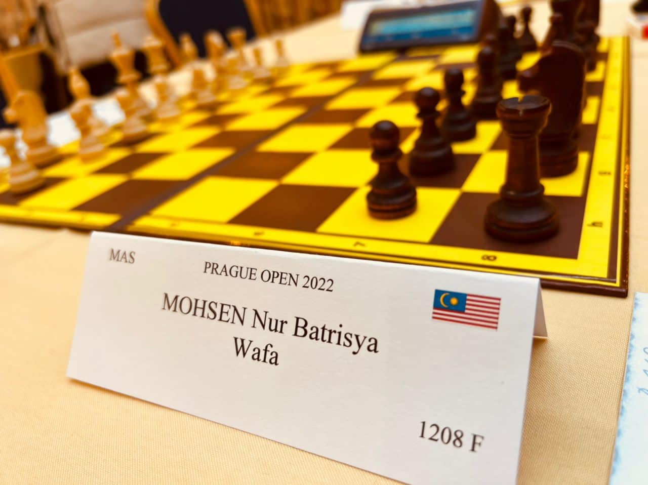 Nur Batrisya's name on a standee at the international chess tournament.