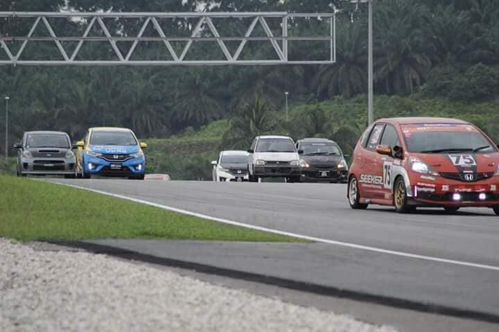 26-year-old Muhammad Iqbal racing his first-generation 4-speed Perodua Kancil on the track.