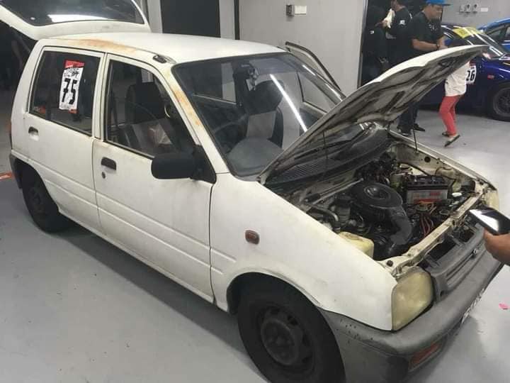 26-year-old Muhammad Iqbal racing his first-generation 4-speed Perodua Kancil on the track.