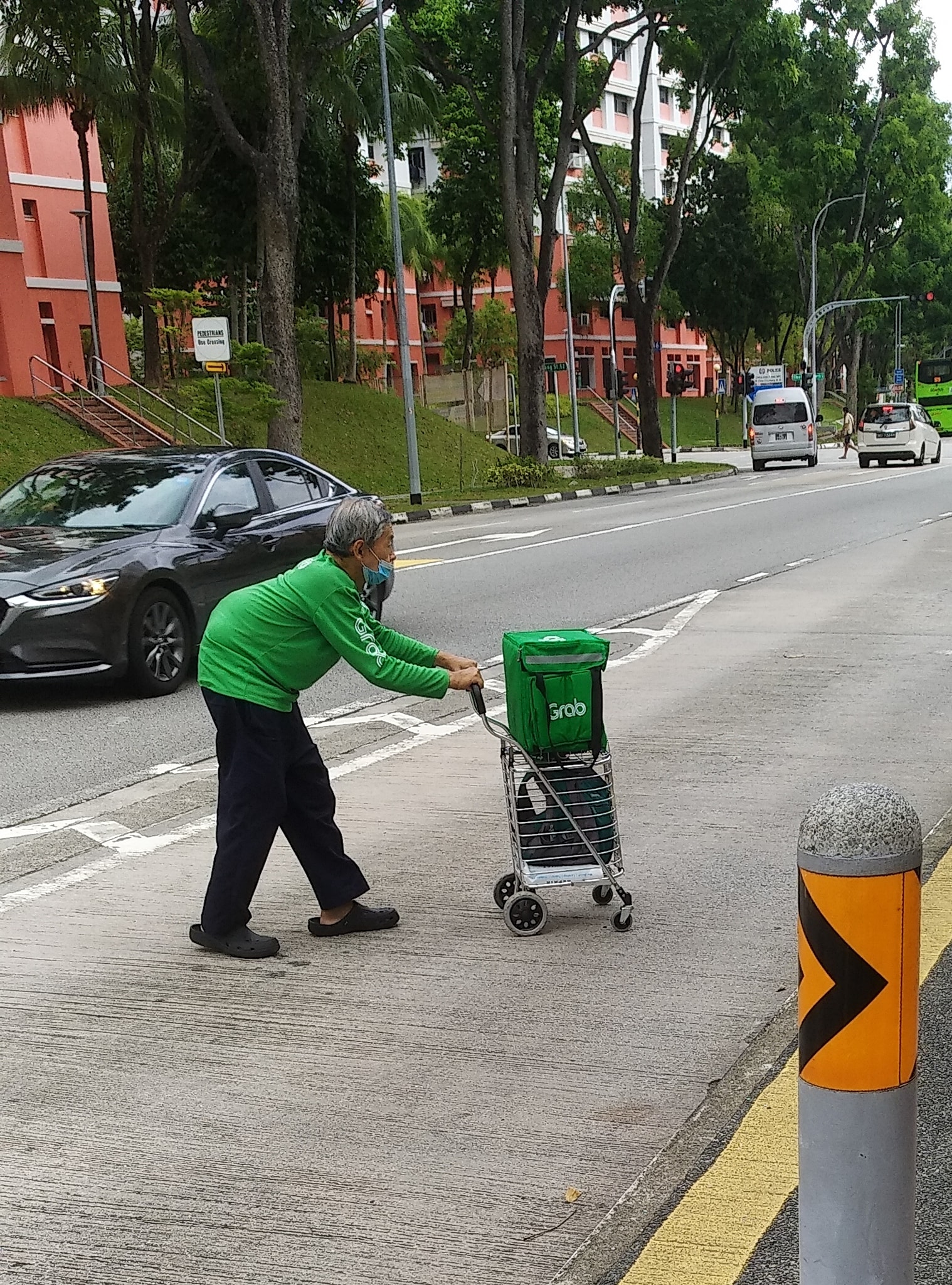 Uncle Wong is often seen pushing a small trolley while making his deliveries.