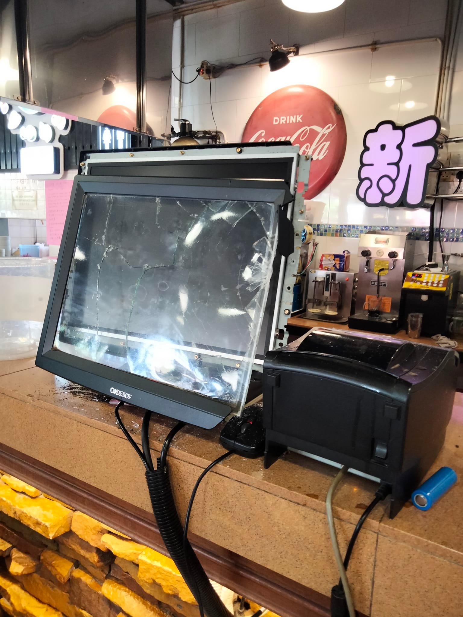 Items damaged by the man wielding a stick in the kopitiam include a temperature scanner, a cash register machine and a glass shelf.