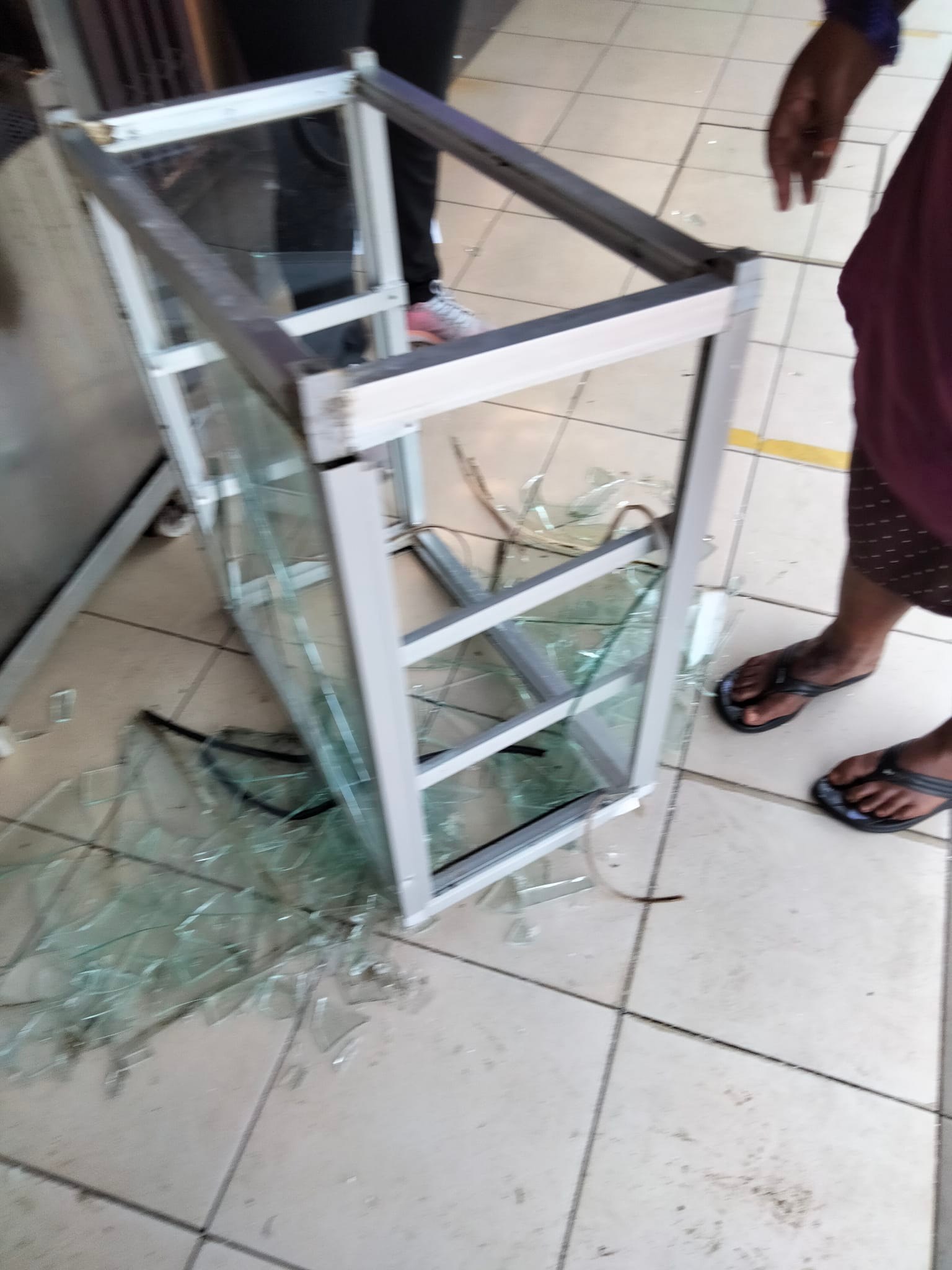 Items damaged by the man wielding a stick in the kopitiam include a temperature scanner, a cash register machine and a glass shelf.
