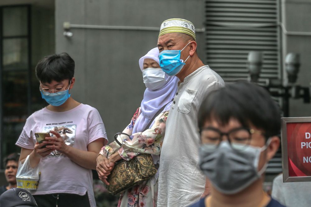 Face masks will no longer be mandatory in open spaces moving forwards. Source: Malay Mail