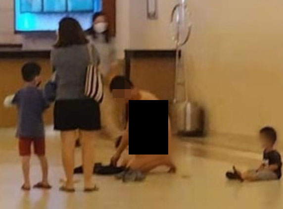 The man was seen stripping naked in Genting before kneeling on the ground. Source: China Press