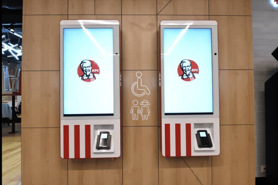 Self-order kiosks are now commonplace in many fast food restaurants. Image credits: KFC