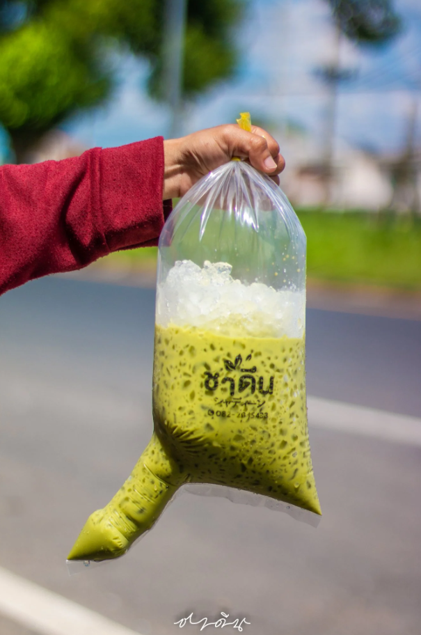 A Thai cafe has gone viral for serving drinks in phallic plastic bags. Image credit: Sanook News