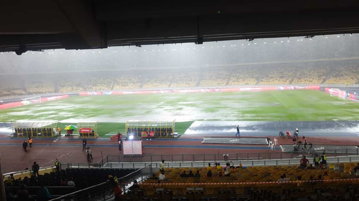 The field in Bukit Jalil stadium had been left waterlogged as a result of heavy rain. Image credit: Harian Metro