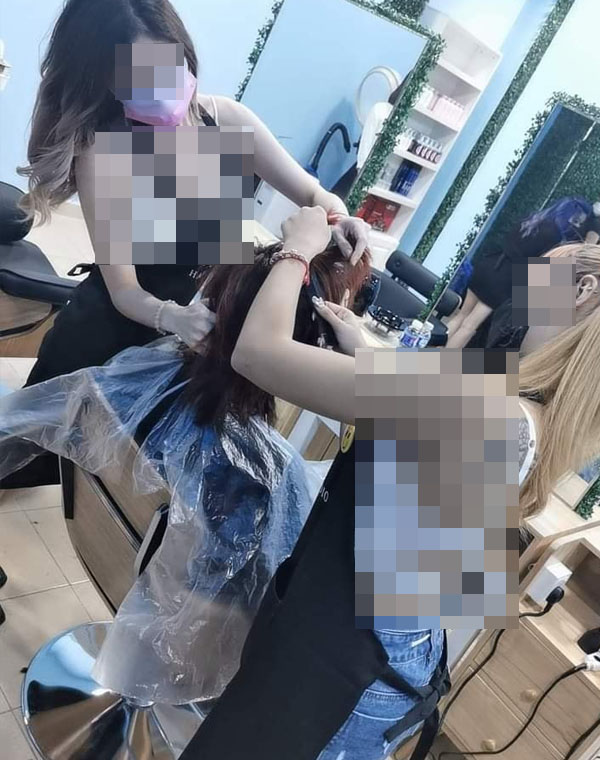 AJ Hair Studio landed themselves in hot water after using scantily-clad Thai models to promote their grand opening. Image credit: The Reporter