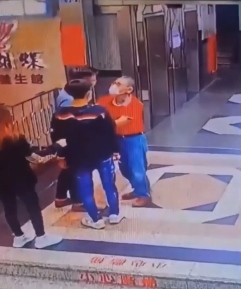 The old man was confronted by the two youngsters at the elevator lobby again. Image credit: Braelyn Shah