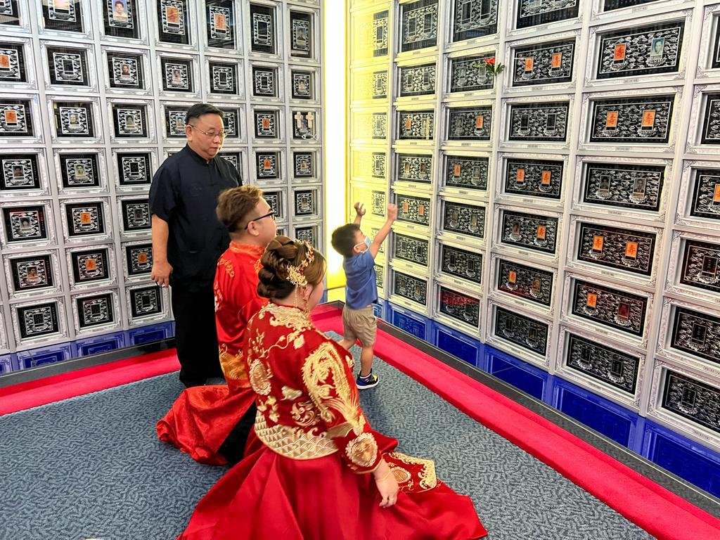 A Singaporean couple had their wedding photos taken at a funeral parlour's columbarium. Image credit: Nirvana Memorial Garden Singapore