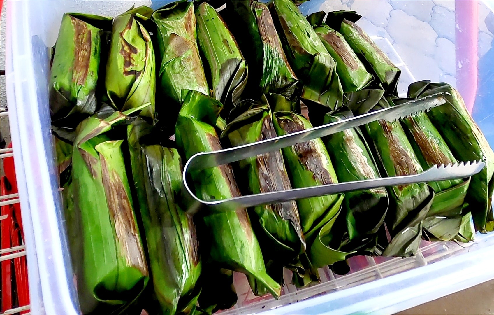 16-year-old Ilham has been selling nasi lemak and pulut panggang to help alleviate his family's financial burden since he was 10-years-old. Image credit: FS Channel