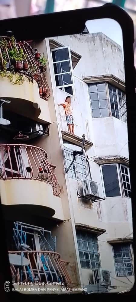 An eight-year-old boy tried to escape from abuse by climbing out through an apartment window. Image credit: BERNAMA