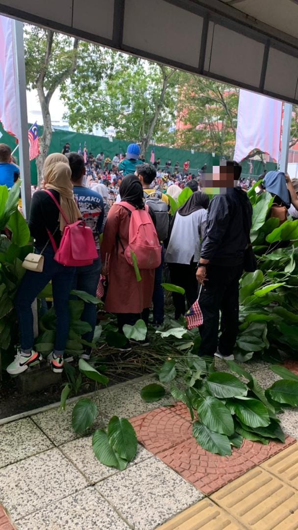 DBKL has admonished spectators who trampled on landscaped greenery during the Merdeka parade. Image credit: DBKL