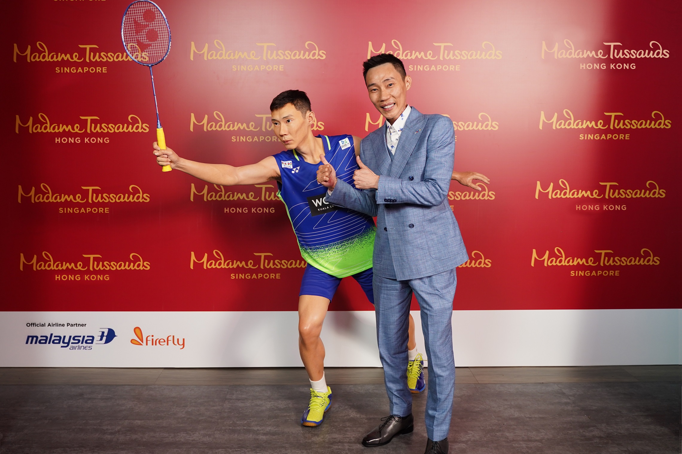 Datuk Lee Chong Wei standing next to his waxwork statue at Madame Tussauds. Image credit: Provided to WauPost