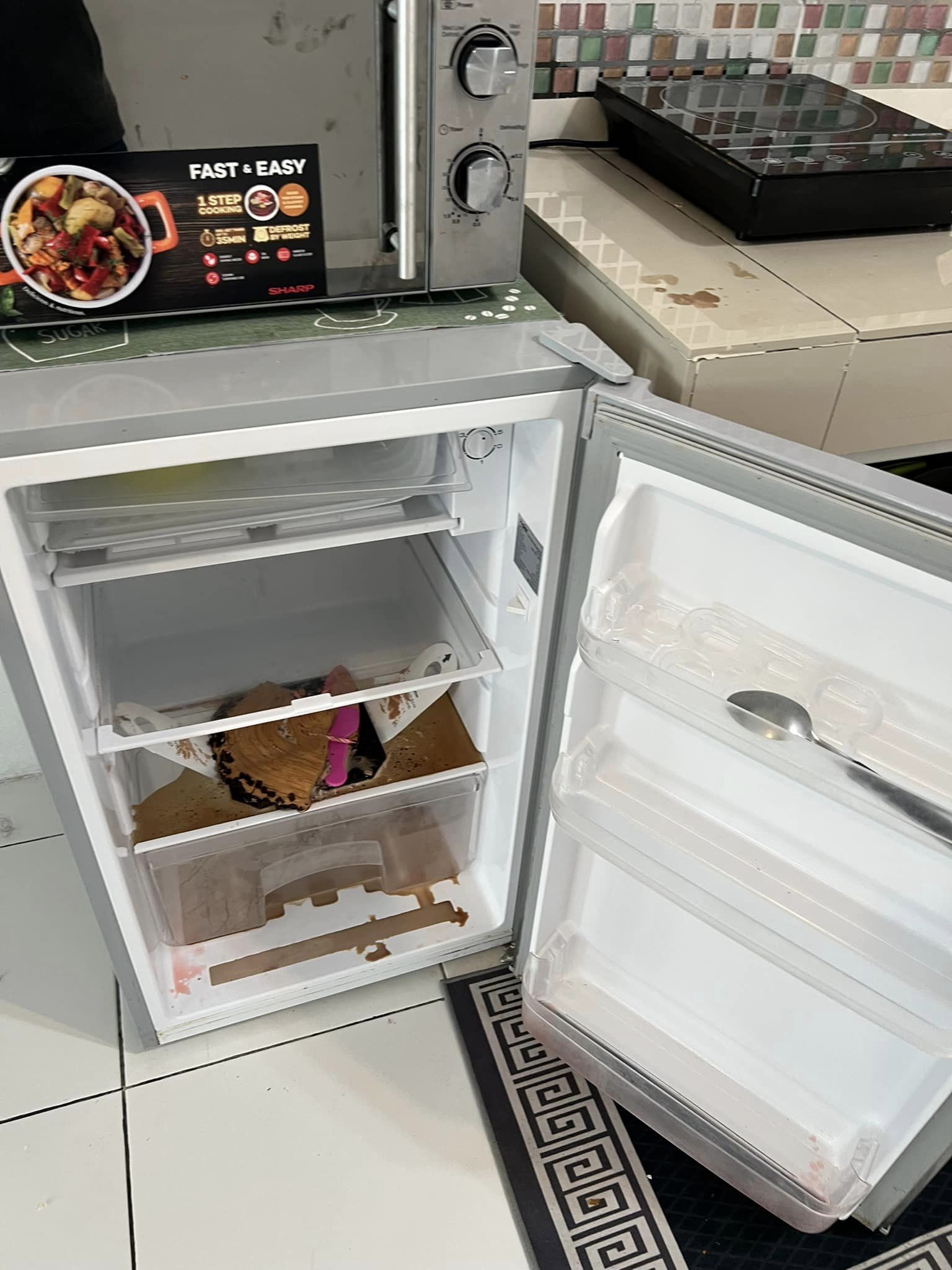 A leftover cake and chocolate spill was found in the fridge. Image credit: Nur Izzati Nadia