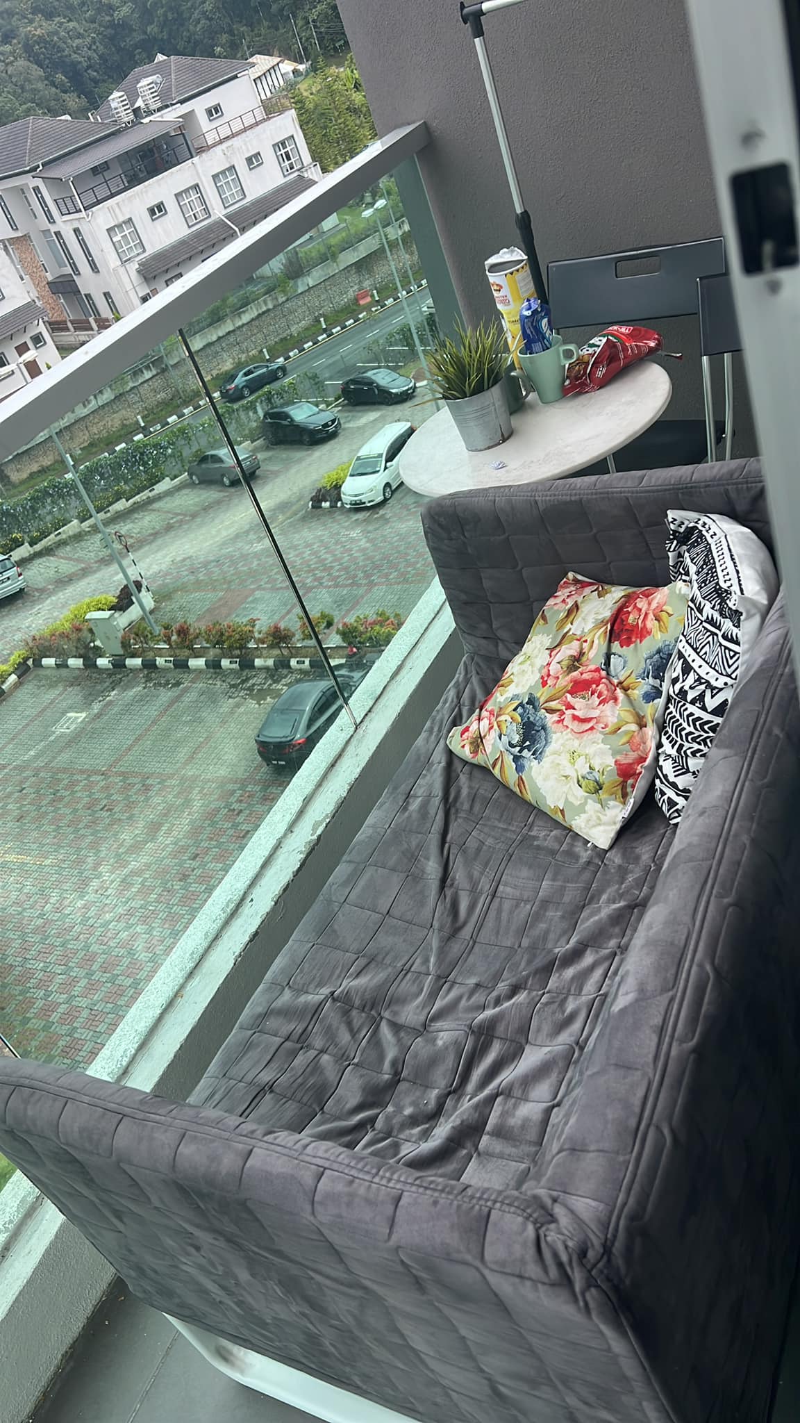 A loveseat was shifted out onto the balcony and left in place after they checked out of the homestay. Image credit: Nur Izzati Nadia